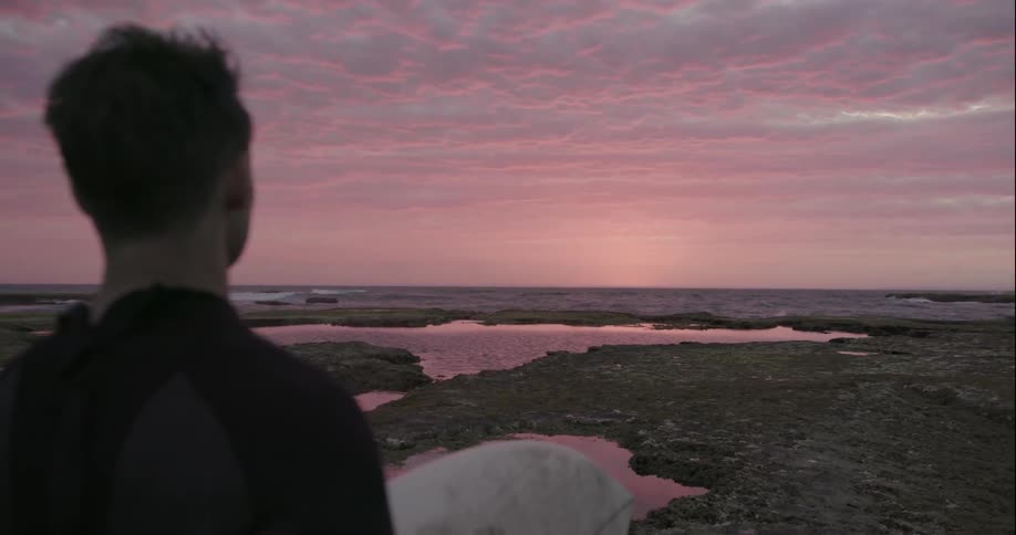 Man looks out at the water
