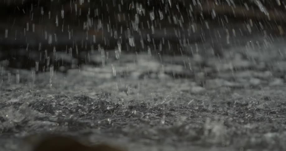 Person splashes water in a shallow stream