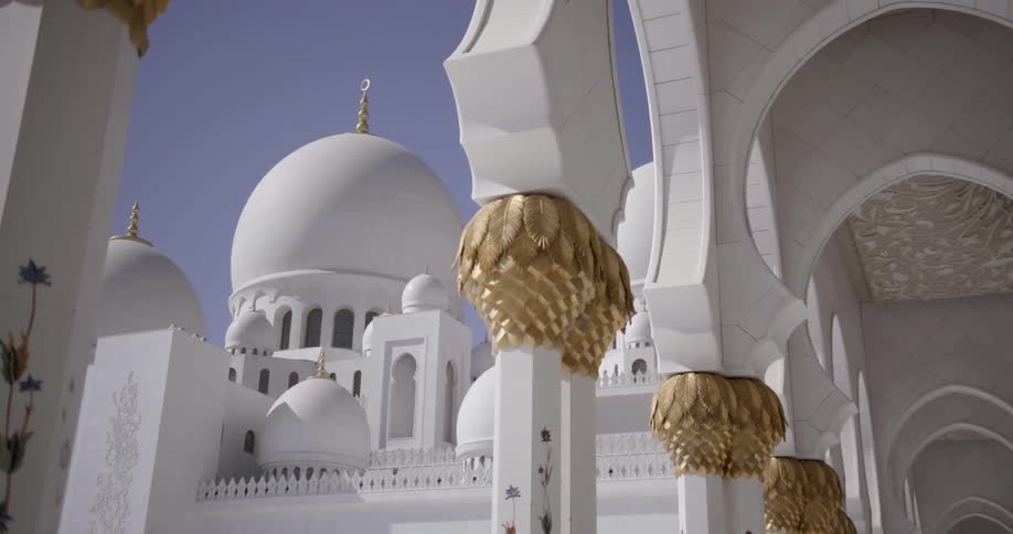 A large temple is all white with gold trim