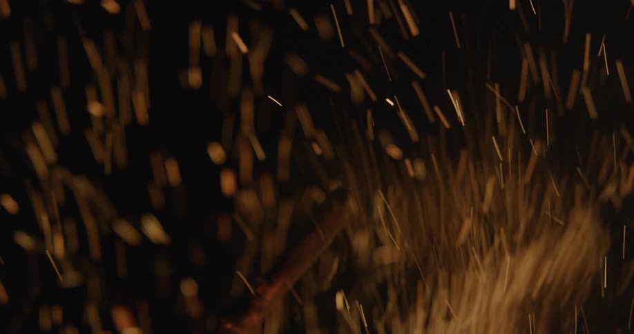 A campfire is giving off sparks