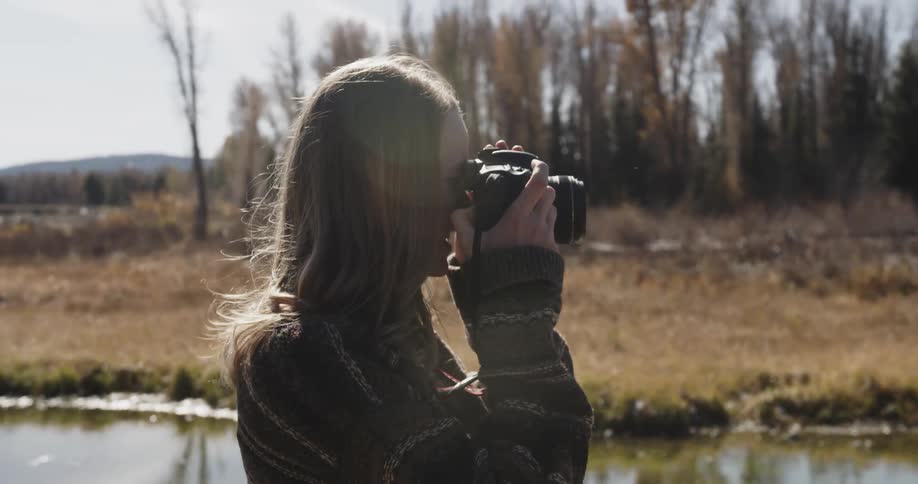 A woman photographer working in the field