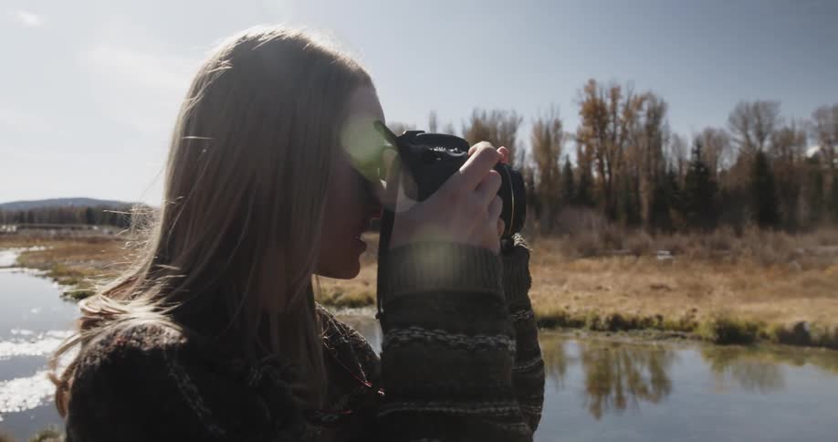 A woman photographer takes a picture