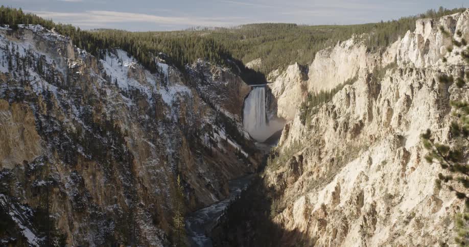 Aerial view of a stream flowing through mountains