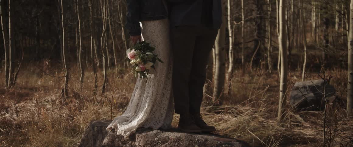 A woman's dress and a man's suit in the middle of the woods