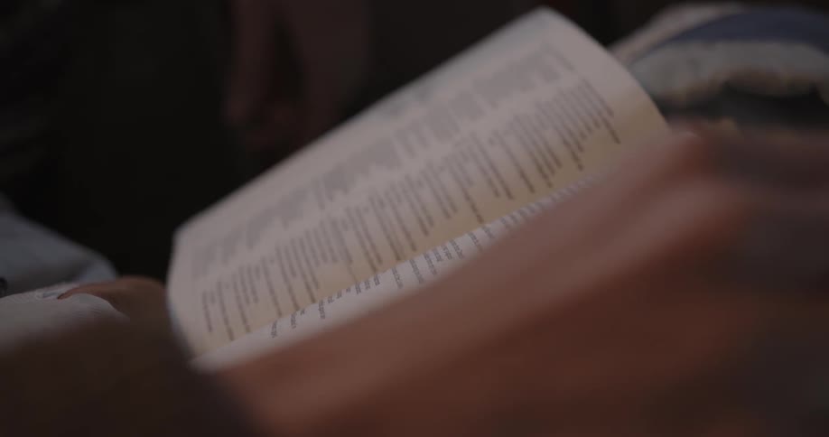 Closeup of woman reading a bible