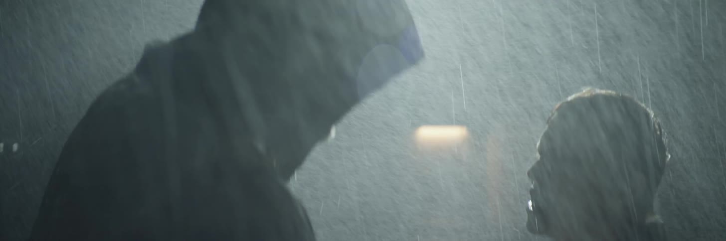 A woman fights with a man in the rain at night