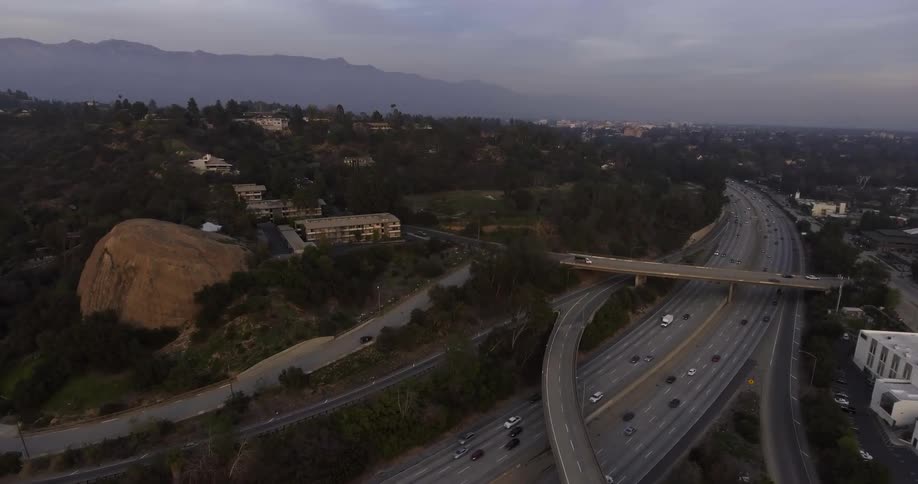 Cars drive on a city highway