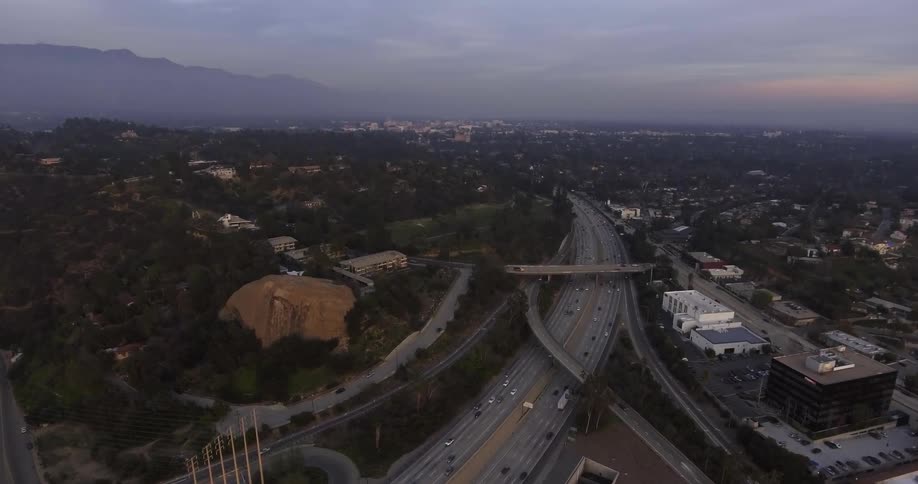 Cars drive on a city highway