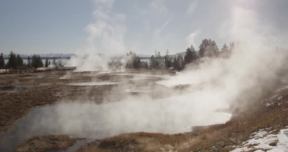 Steam slowly rises from the earth of this field