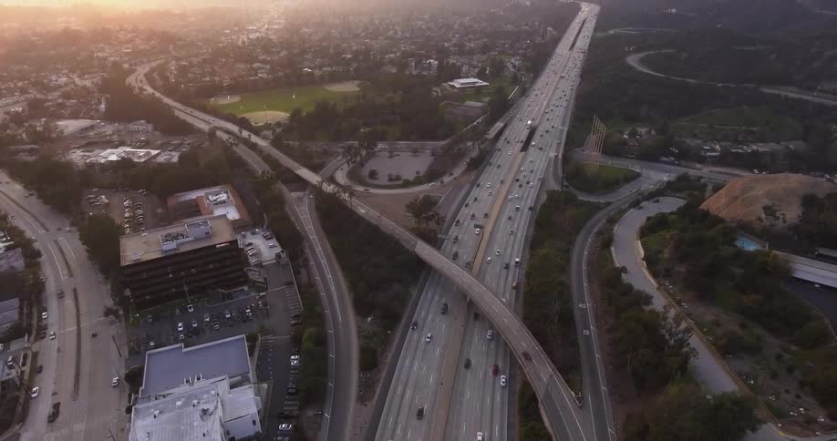 Cars drive on a city highway