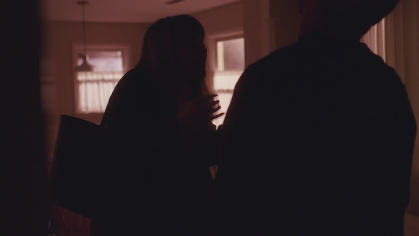 Man and woman argue in a house