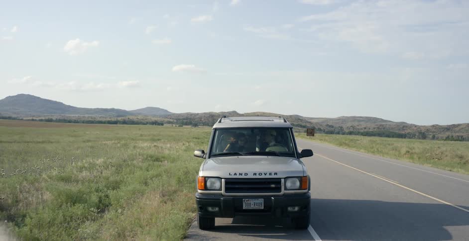 Jeep stopping on the side of a country road