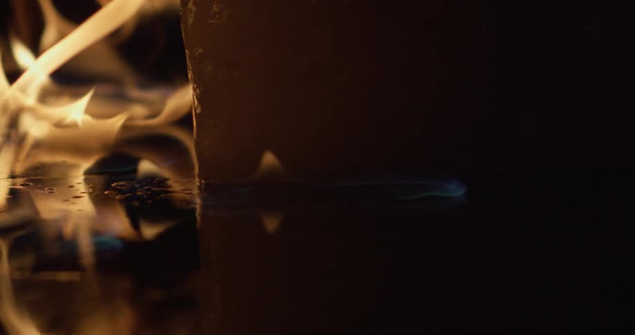 A fire flickers and burns