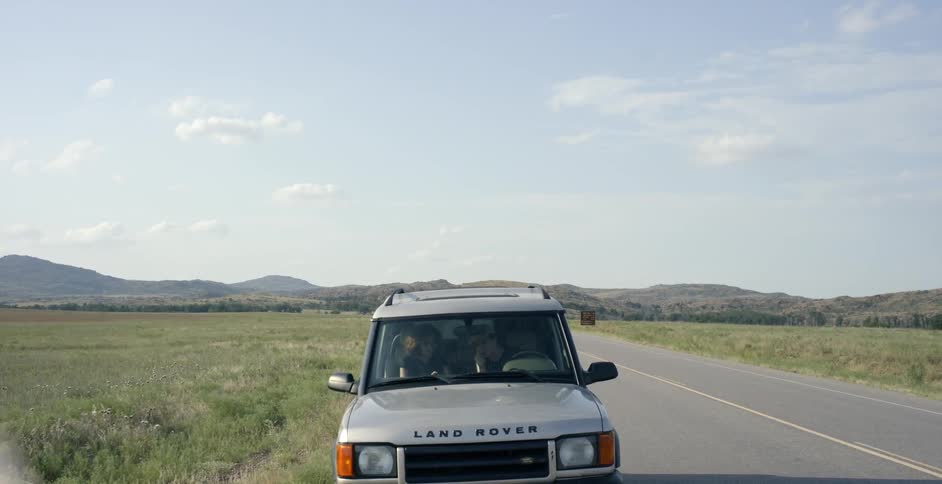 Jeep parked at the side of a country road