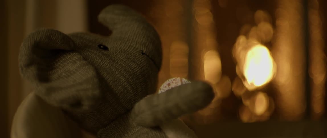 Close up of a gray stuffed elephant
