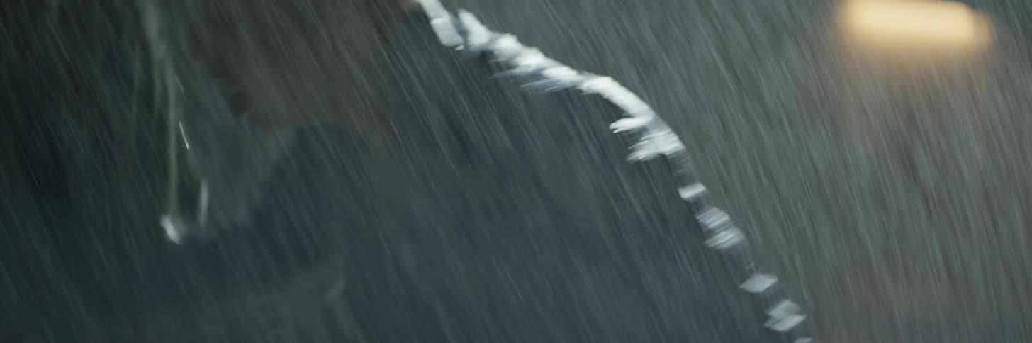 A woman fights a man and collapses in the rain