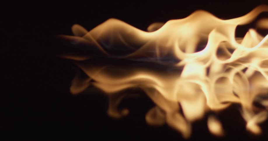 Flame glows and moves across a surface