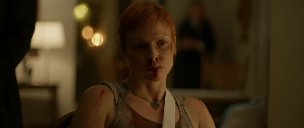 A woman is covered in cuts and blood