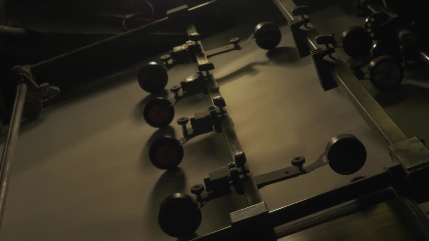 A machine is rolling paper through it's wheels