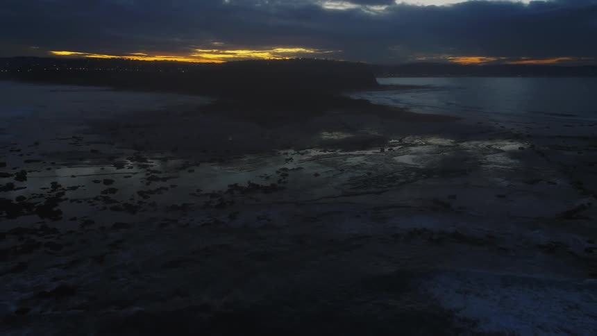 The water surrounds this island at dawn