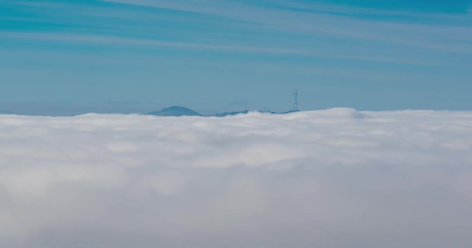 Clouds billow and float with a blue sky above