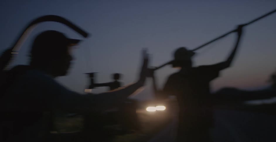 A group of people filming at night and talking