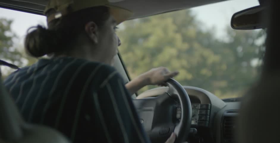 A man is turning his car driving around