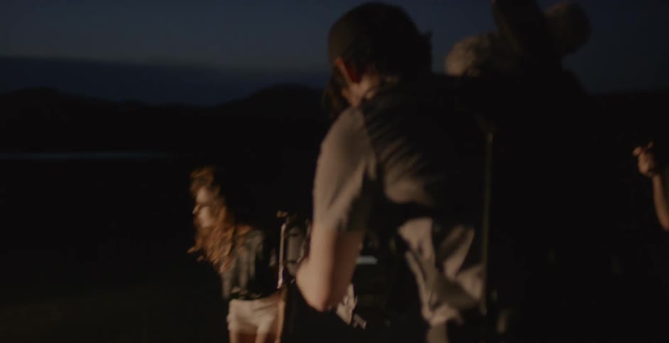 A man films a woman with a camera