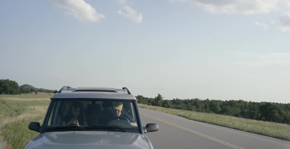 Jeep parked at the side of a country road