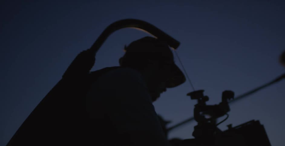 A group of people filming in the dark
