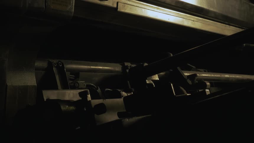 Large machine in a dimly lit room