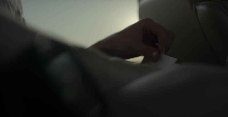 Person looking at small squares of paper