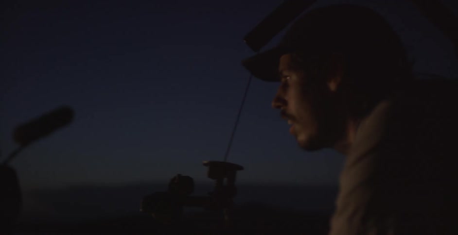 A man flying things at night time