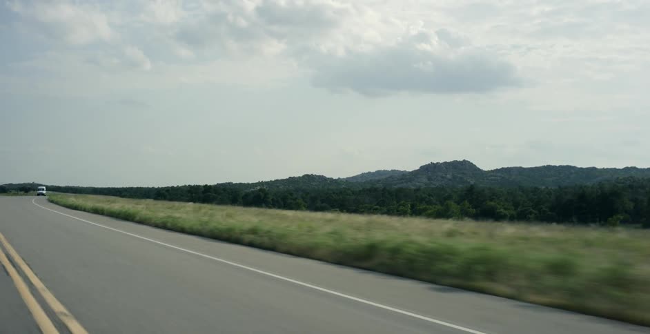 A vehicle driving down the road