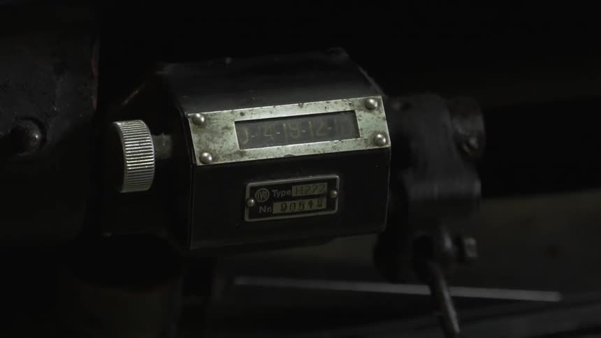 The machine clicks as the dial counts up