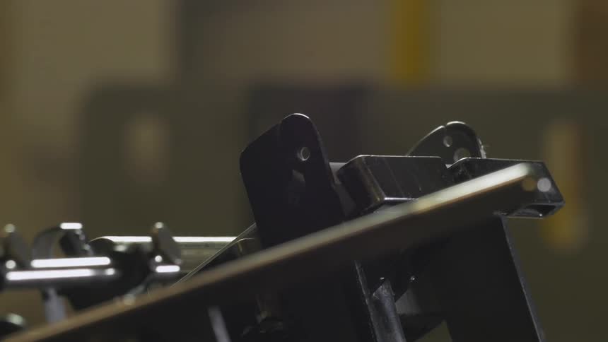 A machine is pressing paper