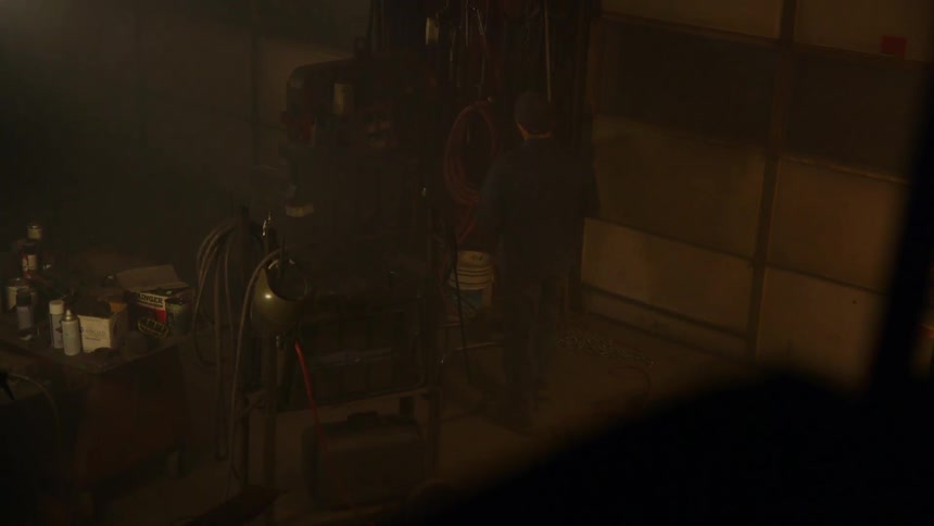 Man walking in a garage at night