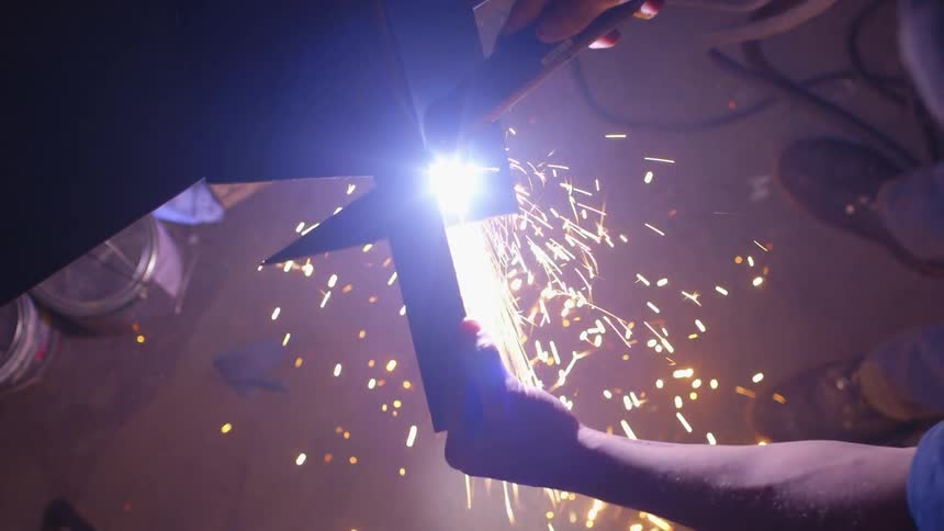 A man lights his torch and begins his work