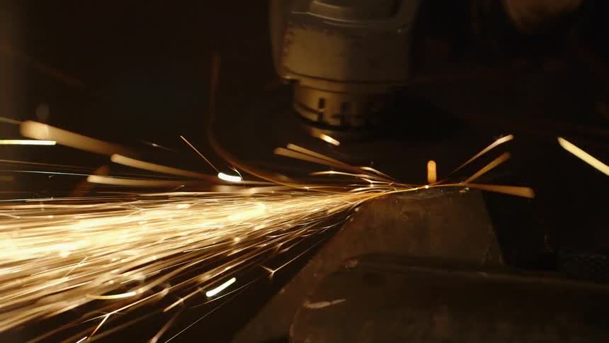 Sparks fly from a grinding power tool