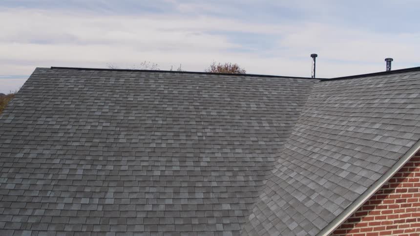 A zoomed out view of a roof of a house