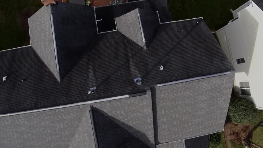 The houses below have grey roofs
