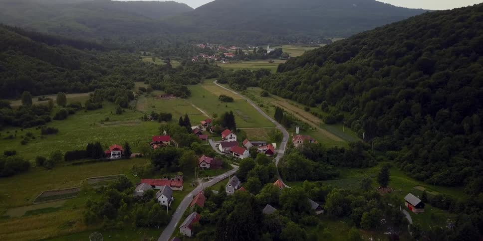 The hills near the town are covered with trees