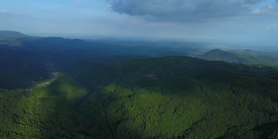 Tree covered hills on a cloudy day