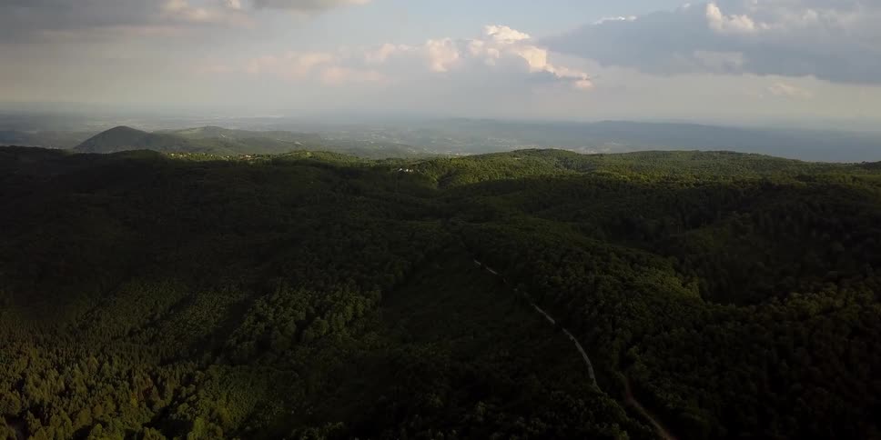 Clouds float above a hilly expanse