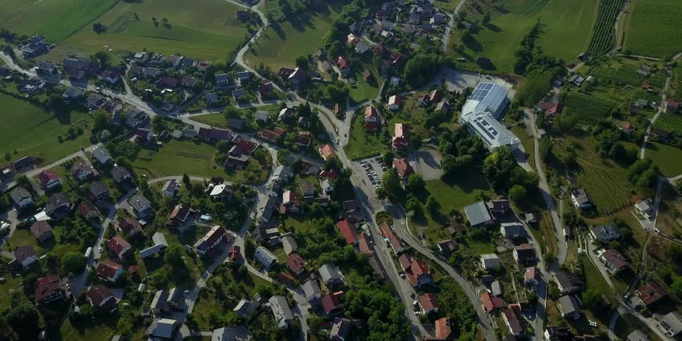 A residential area is shown on a sunny day