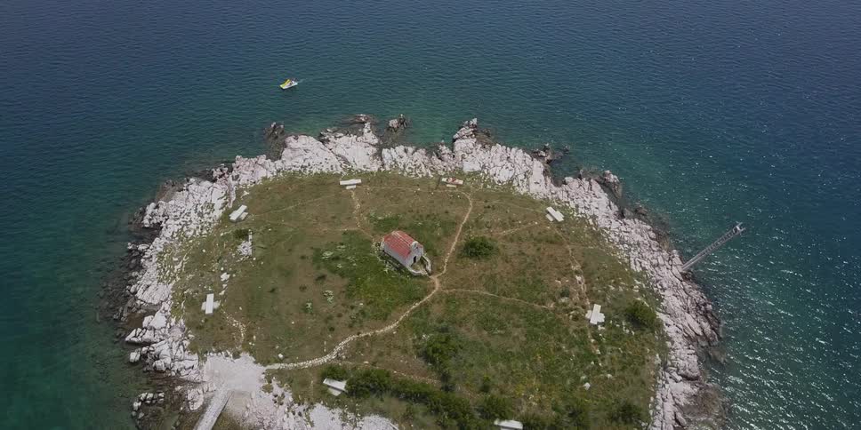 Small island in the middle of a large body of water