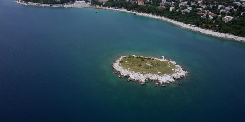 Small island in the middle of a large body of water