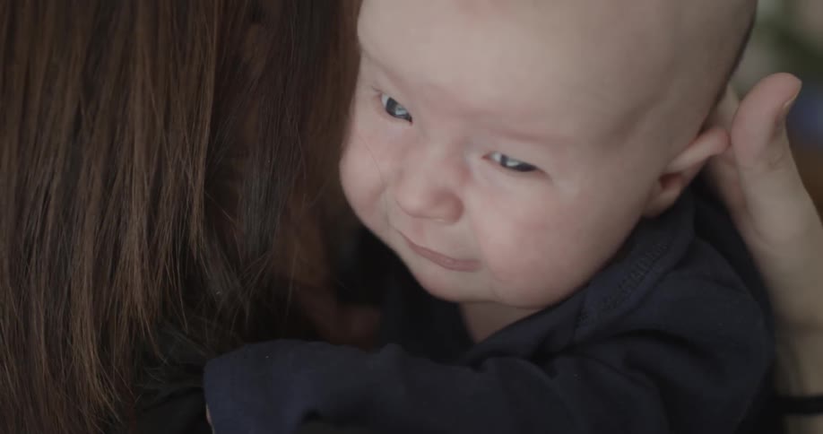 Woman holding a crying baby