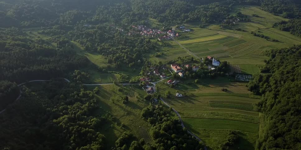 Aerial view of two small villages surrounded by trees