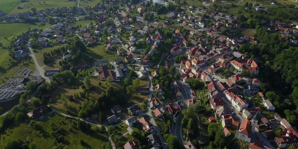 A town sits on this green hillside